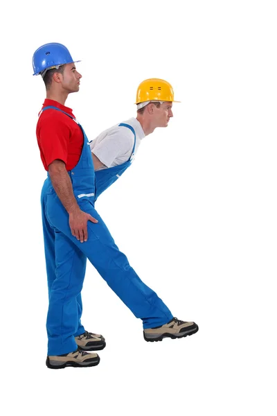 Two laborer standing in shape of K letter — Stock Photo, Image