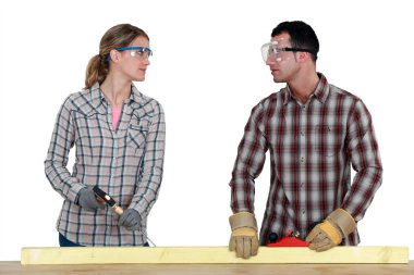 Carpenters making eye contact clipart