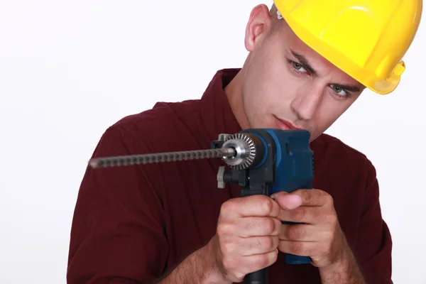 Tradesman apontando uma ferramenta elétrica — Fotografia de Stock