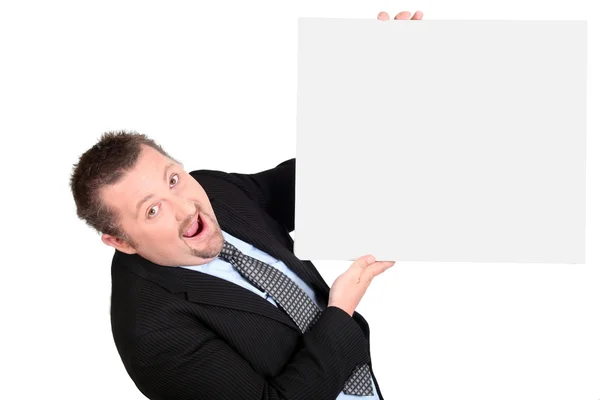 Empresário espantado com um quadro em branco — Fotografia de Stock