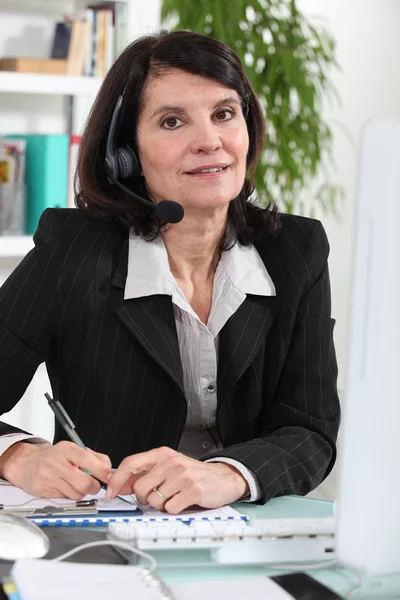 Secretary wearing a headset — Stock Photo, Image