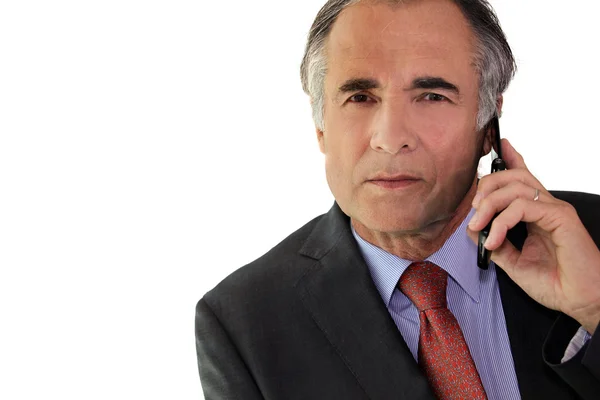 Businessman using a cellphone in the office — Stock Photo, Image