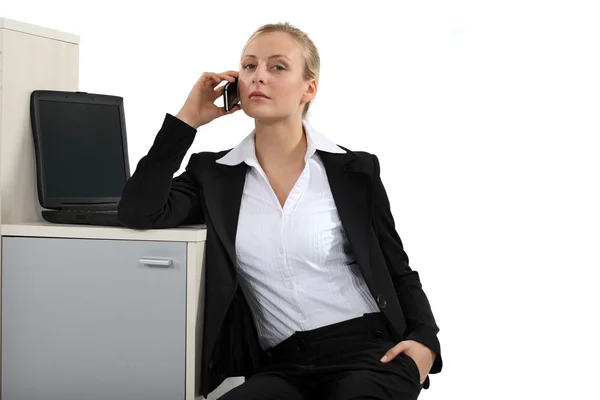 Serious blond businesswoman making a call — Stock Photo, Image