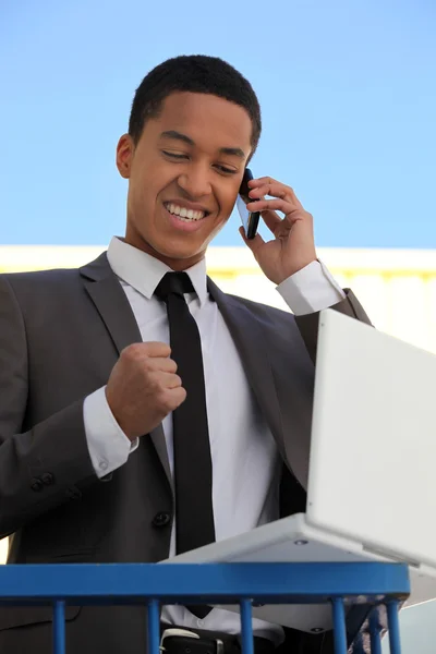 Delighted businessman on the phone — Stock Photo, Image
