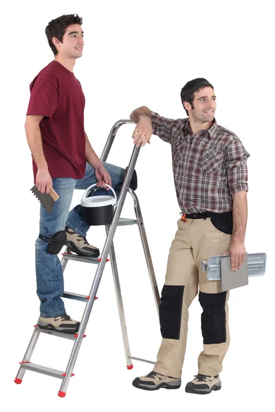 Two tilers pausing to look at something — Stock Photo, Image