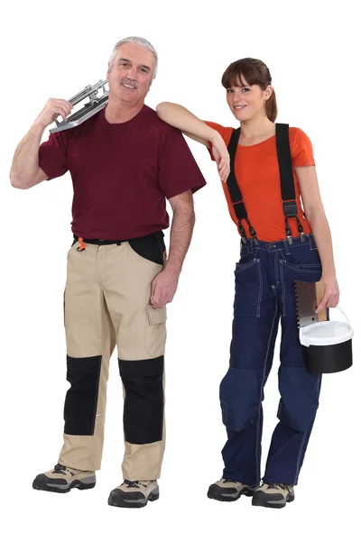 Portrait of experienced craftsman and female apprentice — Stock Photo, Image