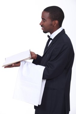 Black waiter giving the bill clipart