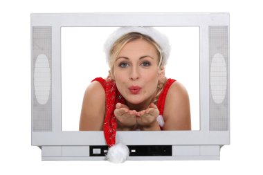 Woman pulling Santa hat clipart