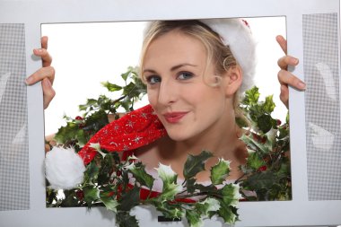 Christmassy woman inside a television set clipart
