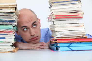 Man overwhelmed with folders clipart