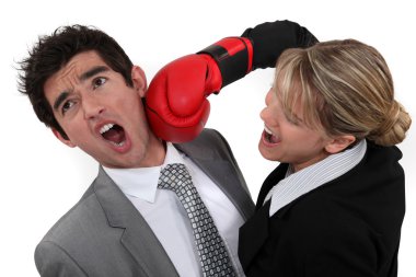 Businessman and businesswoman boxing clipart