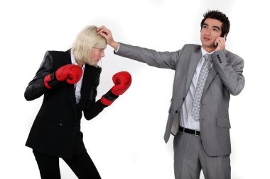 Man taking a break from fighting with his colleague to answer the phone clipart