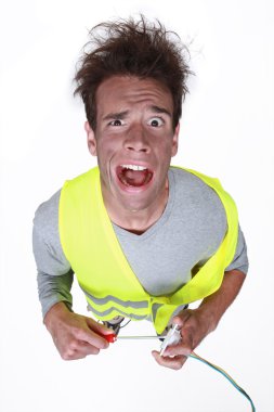 Electrician having an electric shock clipart