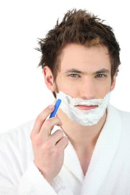 Man shaving his beard clipart