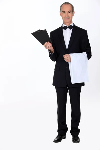 Waiter with menus — Stock Photo, Image