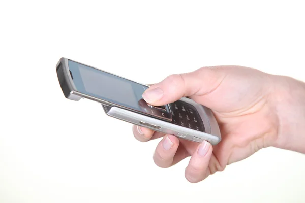 Vrouwelijke witte hand omgaan met mobiele telefoon — Stockfoto