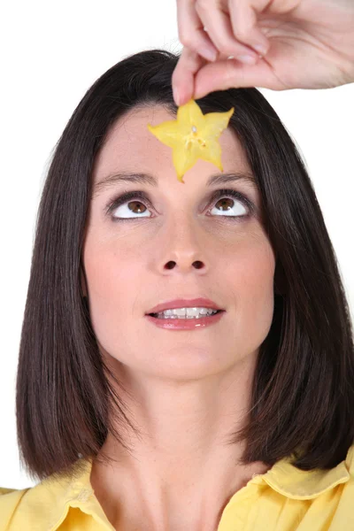 Woman holding a star — Stock Photo, Image