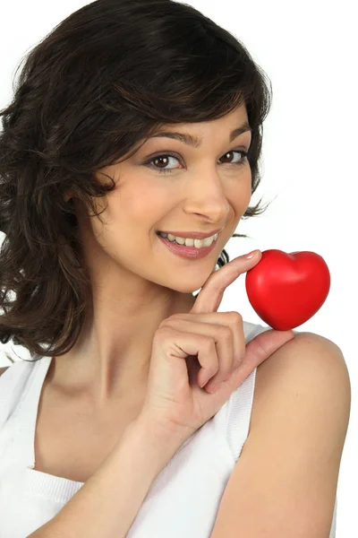 Woman holding a little heart in her hand — Stock Photo, Image