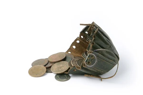 Coins next to old string purse — Stock Photo, Image