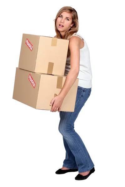Woman carrying boxes — Stock Photo, Image