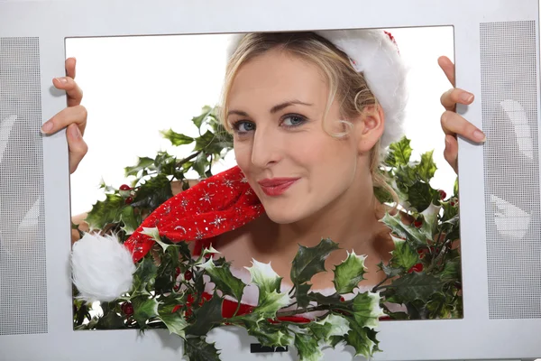 Vánoční žena uvnitř televizorů — Stockfoto