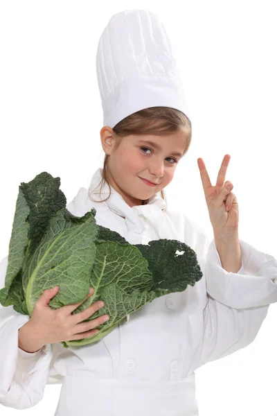 Schoolgirl dressed as a cook — Stock Photo, Image