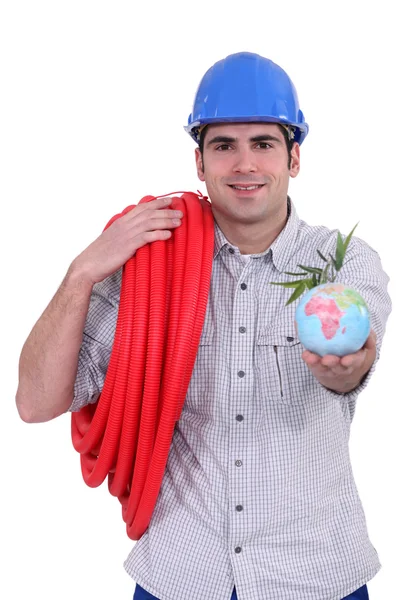 Hantverkare som håller en jordglob — Stockfoto