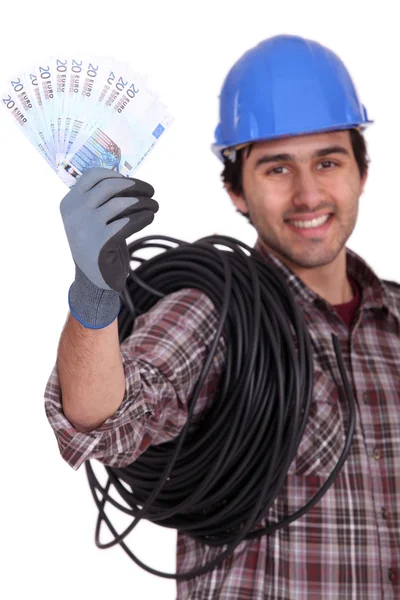 Craftsman holding money — Stock Photo, Image