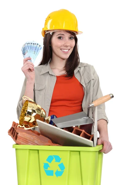 Woman making money by recycling — Stock Photo, Image