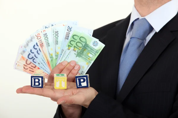 Businessman holding bank notes — Stock Photo, Image