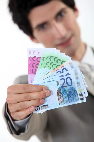 Businessman holding bank notes — Stock Photo, Image