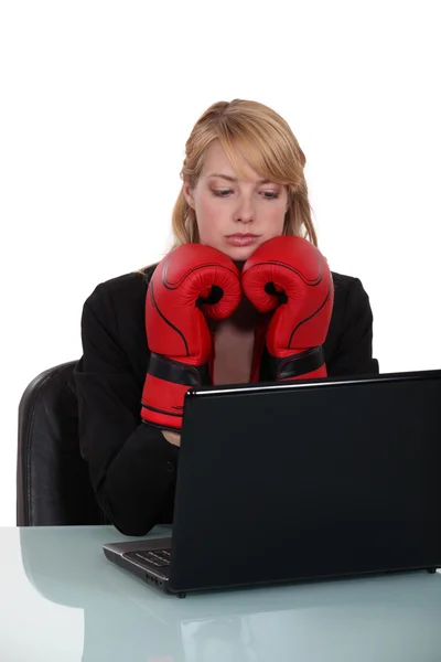 Not easy to type with boxing gloves. — Stock Photo, Image
