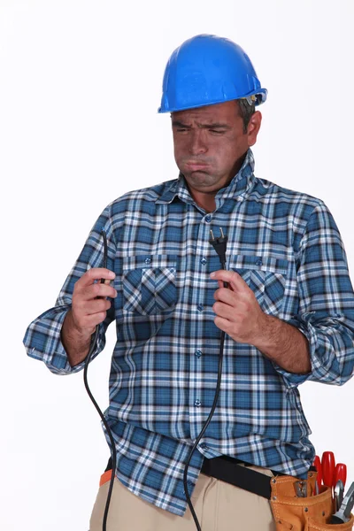 Untrained electrician getting a shock — Stock Photo, Image