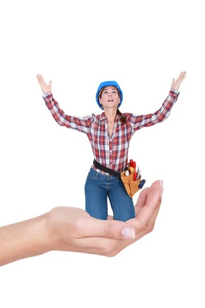 Woman laborer kneeling in a hand looking desperate — Stock Photo, Image