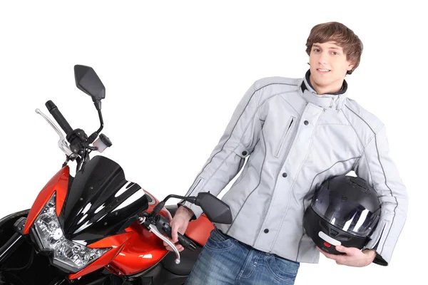 Ung person med motorcykel — Stockfoto