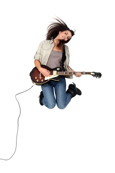 Girl with guitar jumping — Stock Photo, Image