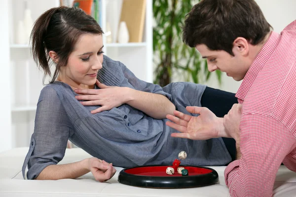 stock image Couple playing dice