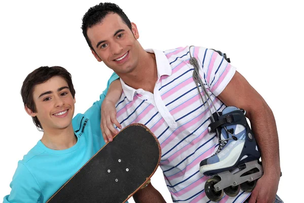 Father and teenager enjoying sport together — Stock Photo, Image