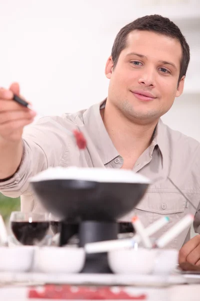 Young brunette with fondue — Stock Photo, Image
