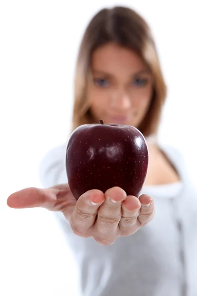 Portrait of a woman holding an apple — Stock Photo, Image