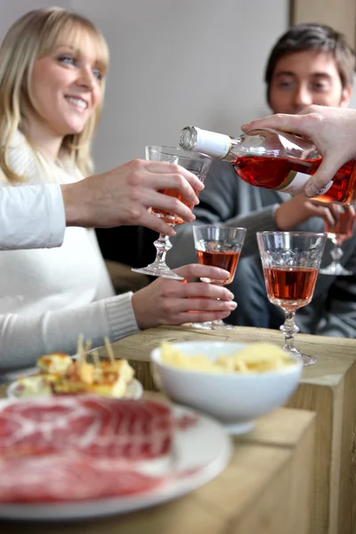 Friends having an informal dinner party — Stock Photo, Image