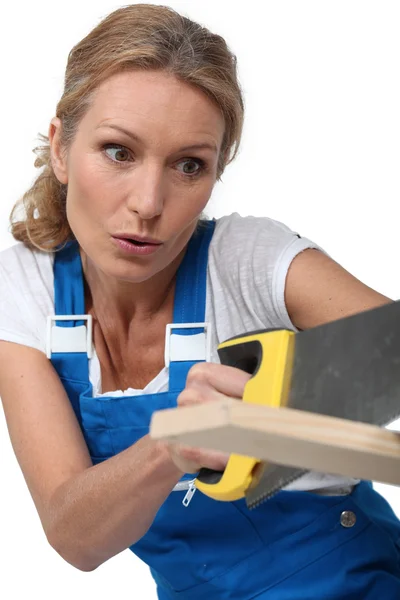 Woman sawing — Stock Photo, Image