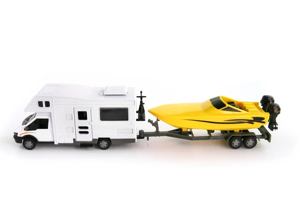 Toy camper van and speed boat — Stock Photo, Image