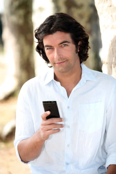 Homem com telefone móvel — Fotografia de Stock