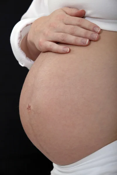 Brzuch kobiety w ciąży — Zdjęcie stockowe