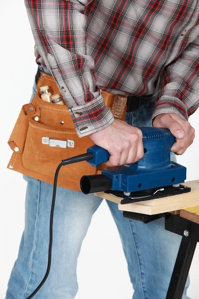 Craftsman working on a wooden board — Stock Photo, Image