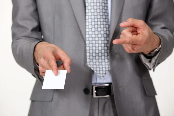 Man pointing at business card — Stock Photo, Image