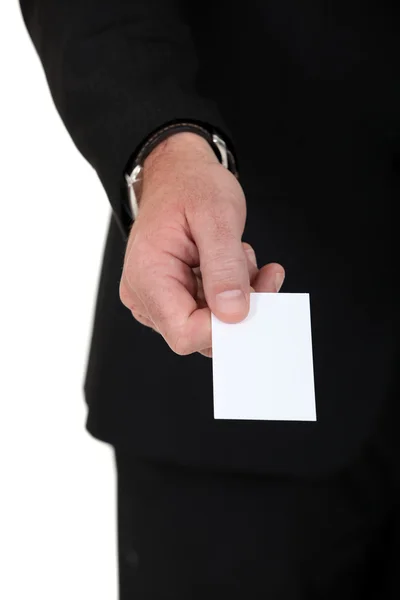 Hand of a man giving business card — Stock Photo, Image
