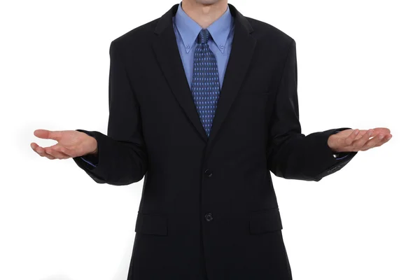 Unidentifiable businessman with palms up — Stock Photo, Image