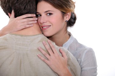 A woman hugging a man clipart
